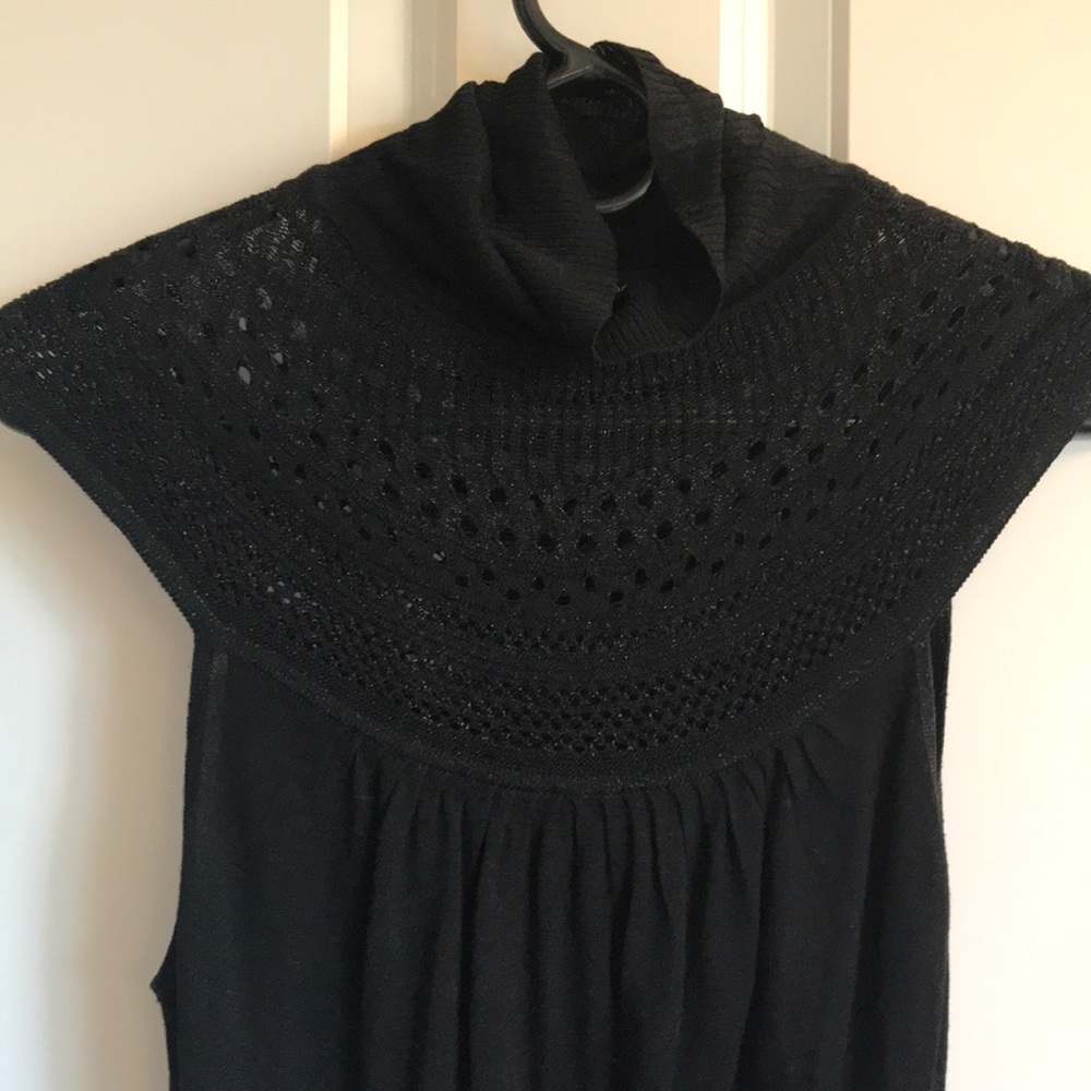 Arden B. Cutout metallic tank.